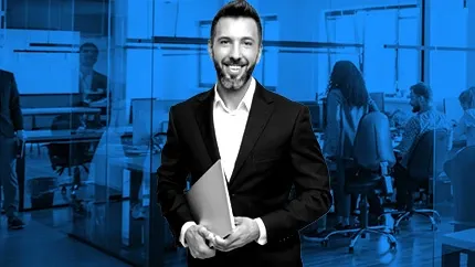 male manager holding a laptop